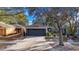 One-story house with gray garage door and landscaped front yard at 410 Pine Pointe Ct, Seffner, FL 33584