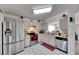 Stainless steel appliances and view to living room at 410 Pine Pointe Ct, Seffner, FL 33584