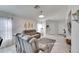 Living room features gray sofas, tile floors, and lots of natural light at 410 Pine Pointe Ct, Seffner, FL 33584