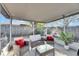 Relaxing screened porch with wicker furniture at 410 Pine Pointe Ct, Seffner, FL 33584