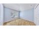 Empty bedroom featuring neutral paint, carpet floors, a window with blinds, and closet with bi-fold doors at 4317 Knollcrest Ct, Spring Hill, FL 34609