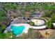 Aerial view of community amenities, including pool, clubhouse, playground, and splash pad at 4317 Knollcrest Ct, Spring Hill, FL 34609