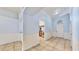 Inviting entryway featuring tile flooring, high ceilings, and a view into the kitchen at 4317 Knollcrest Ct, Spring Hill, FL 34609