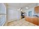 Bright kitchen area with tile flooring, wooden cabinets, and a breakfast bar at 4317 Knollcrest Ct, Spring Hill, FL 34609