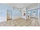 Open-concept living room featuring neutral paint, tile floors, and ample natural light at 4317 Knollcrest Ct, Spring Hill, FL 34609