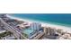 Aerial view of beachfront property with tennis courts and pool at 4950 Gulf Blvd # 401, St Pete Beach, FL 33706