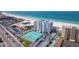 Aerial view of beachfront property with tennis courts and pool at 4950 Gulf Blvd # 401, St Pete Beach, FL 33706