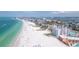 Drone view of beachfront property and coastline at 4950 Gulf Blvd # 401, St Pete Beach, FL 33706