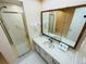 Clean bathroom with vanity, shower, and tiled floors at 4950 Gulf Blvd # 401, St Pete Beach, FL 33706