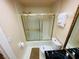Clean bathroom with shower/tub, toilet, and vanity at 4950 Gulf Blvd # 401, St Pete Beach, FL 33706