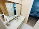 Double vanity bathroom with large mirror at 4950 Gulf Blvd # 401, St Pete Beach, FL 33706