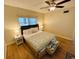 King-size bed, nightstands, ceiling fan in spacious bedroom at 4950 Gulf Blvd # 401, St Pete Beach, FL 33706