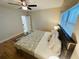 King-size bed, nightstands, ceiling fan in a well-lit bedroom at 4950 Gulf Blvd # 401, St Pete Beach, FL 33706