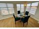Charming dining area with glass table and four chairs at 4950 Gulf Blvd # 401, St Pete Beach, FL 33706