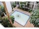 Serene courtyard fountain with lush landscaping at 4950 Gulf Blvd # 401, St Pete Beach, FL 33706