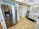 Stainless steel refrigerator and ample kitchen cabinet space at 4950 Gulf Blvd # 401, St Pete Beach, FL 33706