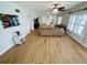 Spacious living room with hardwood floors and large windows at 4950 Gulf Blvd # 401, St Pete Beach, FL 33706
