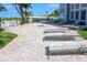 Relaxing patio area with lounge chairs, perfect for sunbathing at 4950 Gulf Blvd # 401, St Pete Beach, FL 33706