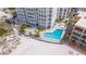 Heated kidney-shaped pool steps from the beach at 4950 Gulf Blvd # 401, St Pete Beach, FL 33706