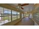 Sunroom with tiled floor, ceiling fans, and views of the backyard at 4955 Reece Rd, Plant City, FL 33566