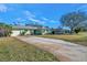 Side view of the house with long driveway at 5229 26Th N Ave, St Petersburg, FL 33710