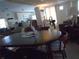Round dining table with four chairs in a bright dining area at 5335 Fairfield S Ave # 78, Gulfport, FL 33707