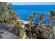 Stunning aerial view of waterfront property with palm trees and ocean access at 5926 Bahama Shores S Dr, St Petersburg, FL 33705