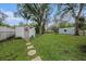 Backyard with shed and stone pathway at 6145 55Th N Ave, St Petersburg, FL 33709