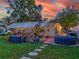 Relaxing backyard oasis with patio, hot tub, and string lights at 6145 55Th N Ave, St Petersburg, FL 33709