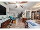 Bright living room with hardwood floors, comfy seating, and built-in shelving at 6145 55Th N Ave, St Petersburg, FL 33709