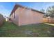 Backyard view of home with wooden fence at 806 E Laura St, Plant City, FL 33563