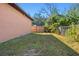Backyard with grassy area and wooden fence at 806 E Laura St, Plant City, FL 33563