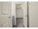 Clean bathroom with gray vanity and access to bedroom at 806 E Laura St, Plant City, FL 33563