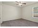 Bright bedroom featuring wood-look flooring and ceiling fan at 806 E Laura St, Plant City, FL 33563