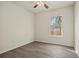 Well-lit bedroom with wood-like floors and ceiling fan at 806 E Laura St, Plant City, FL 33563