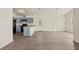 Open living area with vaulted ceilings, grey flooring and an open kitchen at 806 E Laura St, Plant City, FL 33563