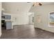 Spacious living area with vaulted ceilings, grey flooring and an open kitchen at 806 E Laura St, Plant City, FL 33563