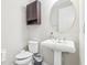 Small bathroom with pedestal sink and toilet at 8836 Citrus Palm Dr, Tampa, FL 33626