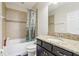Bathroom with tub, shower, granite vanity, and updated fixtures at 8836 Citrus Palm Dr, Tampa, FL 33626
