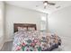 Bright bedroom with floral bedding and ceiling fan at 8836 Citrus Palm Dr, Tampa, FL 33626