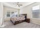 Bedroom with floral bedding and ceiling fan at 8836 Citrus Palm Dr, Tampa, FL 33626