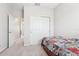 Bedroom with full-size bed and access to hallway bathroom at 8836 Citrus Palm Dr, Tampa, FL 33626
