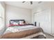 Bedroom with a full-size bed, closet, and window coverings at 8836 Citrus Palm Dr, Tampa, FL 33626