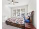 Comfortable bedroom with floral bedding and large window at 8836 Citrus Palm Dr, Tampa, FL 33626