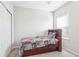 Bedroom with full-size bed, built-in shelving, and closet at 8836 Citrus Palm Dr, Tampa, FL 33626