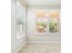 Bright dining room with large windows and tile floor at 8836 Citrus Palm Dr, Tampa, FL 33626