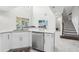 Kitchen with island, stainless steel appliances, and stairs at 8836 Citrus Palm Dr, Tampa, FL 33626