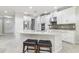 Modern kitchen with island, stainless steel appliances, and white cabinets at 8836 Citrus Palm Dr, Tampa, FL 33626