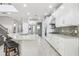 Modern kitchen with island, stainless steel appliances, and white cabinets at 8836 Citrus Palm Dr, Tampa, FL 33626