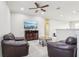 Spacious loft area with leather seating and large TV at 8836 Citrus Palm Dr, Tampa, FL 33626
